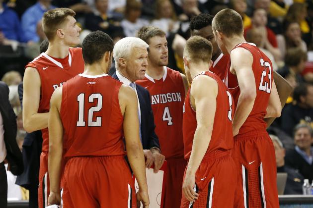 Jan 7, 2015; Richmond, VA, USA; Davidson Wildcats head coach Bob McKillop (middle) talks to his team in the huddle against the Virginia Commonwealth Rams in the second half at Stuart Siegel Center. The Rams won 71-65. Mandatory Credit: Geoff Burke-USA TODAY Sports
