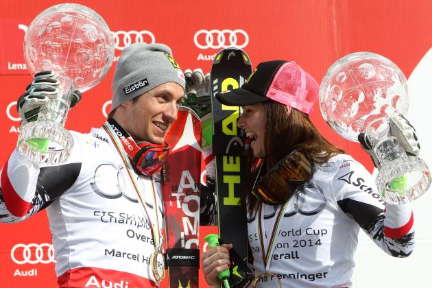 Austria's Marcel Hirscher, left, and compatriot Anna Fenninger smile to eachother as they hold up their overall leader trophies, at the alpine ski World Cup finals in Lenzerheide, Switzerland, Sunday, March 16, 2014.  (AP Photo/Armando Trovati)