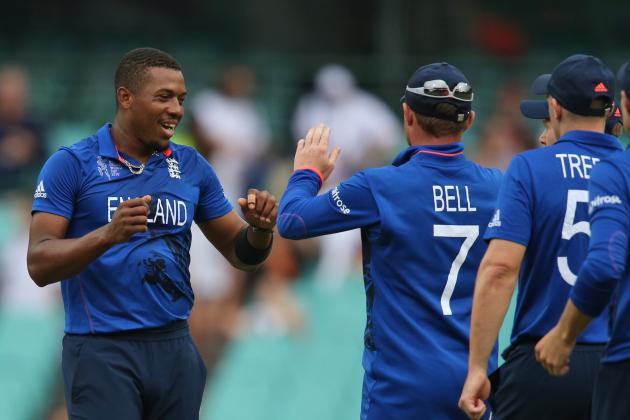 England's Chris Jordan celebrates with teammates after the dismissal of Afghanistan’s Jamal Nasir, a decision that was later recalled, during their Cricket World Cup pool A match in Sydney, Friday, March 13, 2015. (AP Photo/Rick Rycroft)