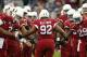 GLENDALE, AZ - NOVEMBER 24: Quarterback Carson Palmer #3 and running back Alfonso Smith #29 of the Arizona Cardinals high five nose tackle Dan Williams #92 as he is introduced to the NFL game against the Indianapolis Colts at the University of Phoenix Stadium on November 24, 2013 in Glendale, Arizona. The Cardinals defeated the Colts 40-11. (Photo by Christian Petersen/Getty Images)