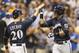 MILWAUKEE, WI - AUGUST 19: Aramis Ramirez #16 of the Milwaukee Brewers gets a high five from teammate Jonathan Lucroy #20 after he hit a two run home run off of Michael Wacha #52 of the St Louis Cardinals in the seventh inning at Miller Park on August 19, 2013 in Milwaukee, Wisconsin. (Photo by Tom Lynn/Getty Images)