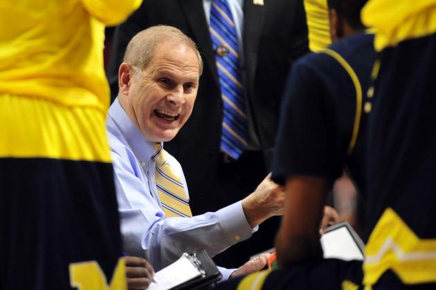 Mar 13, 2015; Chicago, IL, USA; Michigan Wolverines head coach John Beilein talks with his team in a timeout during the first half in the quarterfinals of the Big Ten Tournament at the United Center. Mandatory Credit: David Banks-USA TODAY Sports