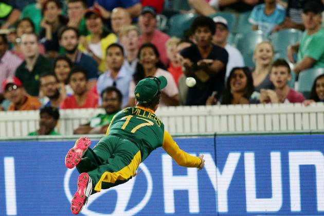 South Africa's AB De Villiers is airborne as he attempts to take a catch during their Cricket World Cup Pool B match against Ireland in Canberra, Australia, Tuesday, March 3, 2015. (AP Photo/Rob Griffith)
