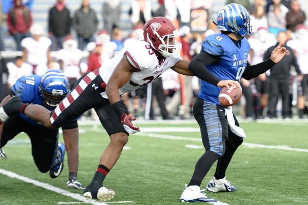 Nov 30, 2013; Memphis, TN, USA; Temple Owls linebacker Haason Reddick (33) tries to bring down Memphis Tigers quarterback Jacob Karam (9) during the second half at Liberty Bowl Memorial. Temple Owls beat the Memphis Tigers 41-21. Mandatory Credit: Justin Ford-USA TODAY Sports