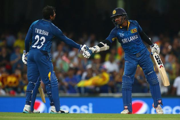 SYDNEY, AUSTRALIA - MARCH 08:  Tillakaratne Dilshan of Sri Lanka congratulates Kumar Sangakkara of Sri Lanka after he passed the milestone of 14000 one day international runs during the 2015 ICC Cricket World Cup match between Australia and Sri Lanka at Sydney Cricket Ground on March 8, 2015 in Sydney, Australia.  (Photo by Mark Kolbe/Getty Images)