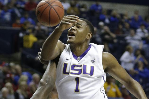 LSU forward Jarell Martin (1) collides with Auburn guard KT Harrell (1) as Martin shoots during the first half of an NCAA college basketball game in the quarter final round of the Southeastern Conference tournament, Friday, March 13, 2015, in Nashville, Tenn. (AP Photo/Mark Humphrey)
