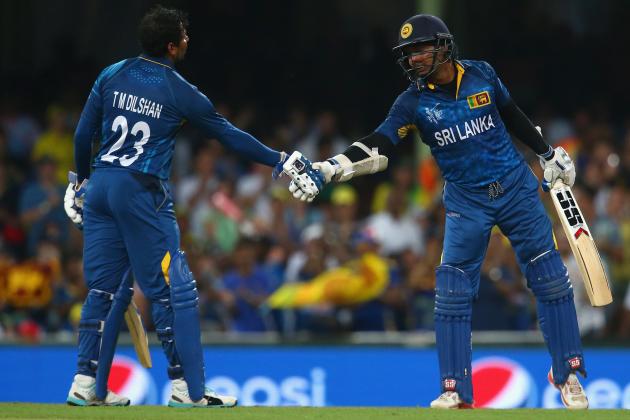 SYDNEY, AUSTRALIA - MARCH 08: Tillakaratne Dilshan of Sri Lanka congratulates Kumar Sangakkara of Sri Lanka after he passed the milestone of 14000 one day international runs during the 2015 ICC Cricket World Cup match between Australia and Sri Lanka at Sydney Cricket Ground on March 8, 2015 in Sydney, Australia. (Photo by Mark Kolbe/Getty Images)