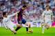 MADRID, SPAIN - OCTOBER 25: Isco of Real Madrid CF tackles Lionel Messi of Barcelona during the La Liga match between Real Madrid CF and FC Barcelona at Estadio Santiago Bernabeu on October 25, 2014 in Madrid, Spain. (Photo by Gonzalo Arroyo Moreno/Getty Images)