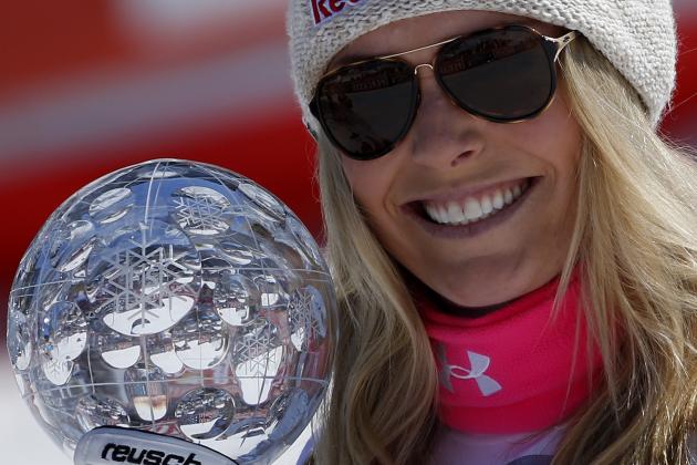 Lindsey Vonn, of the United States, holds the alpine ski, women's World Cup downhill's discipline trophy, at the World Cup finals in Meribel, France, Wednesday, March 18, 2015. (AP Photo/Giovanni Auletta)