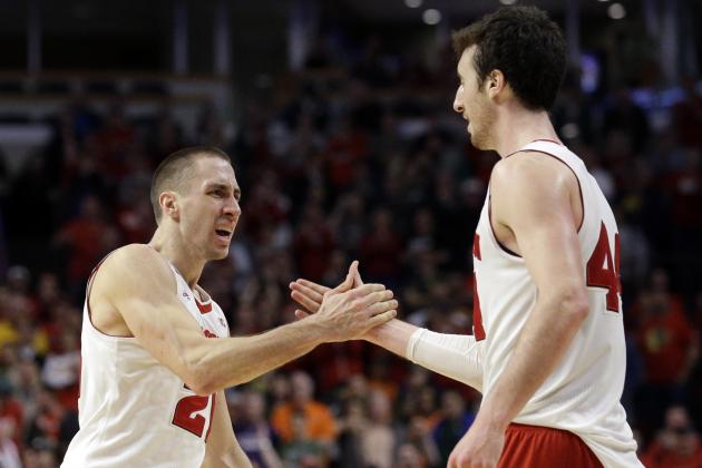 Wisconsin's Josh Gasser (21) and Wisconsin's Frank Kaminsky (44) celebrates in the in the overtime period of an NCAA college basketball game against Michigan State in the championship of the Big Ten Conference tournament in Chicago, Sunday, March 15, 2015.  Wisconsin defeated Michigan State 80-69 in overtime.  (AP Photo/Nam Y. Huh)
