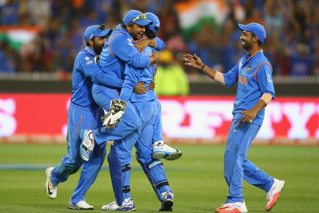 MELBOURNE, AUSTRALIA - MARCH 19:  MS Dhoni and Suresh Raina of India celebrate taking the wicket of Soumya Sarkar of Bangladesh during the 2015 ICC Cricket World Cup match between India and Bangldesh at Melbourne Cricket Ground on March 19, 2015 in Melbourne, Australia.  (Photo by Robert Cianflone/Getty Images)