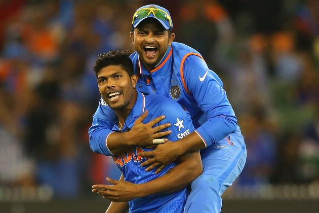 MELBOURNE, AUSTRALIA - MARCH 19:  Umesh Yadav of India is congratulated by Suresh Raina after getting the wicket of Mushfiqur Rahim of Bangladesh during the 2015 ICC Cricket World Cup Quater Final match between India and Bangldesh at Melbourne Cricket Ground on March 19, 2015 in Melbourne, Australia.  (Photo by Quinn Rooney/Getty Images)