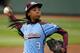 FILE - In this Aug. 15, 2014, file photo, Pennsylvania's Mo'ne Davis delivers in the fifth inning against Tennessee during a baseball game in United States pool play at the Little League World Series tournament in South Williamsport, Pa. The Disney Channel says development is under way on the biographical film, titled