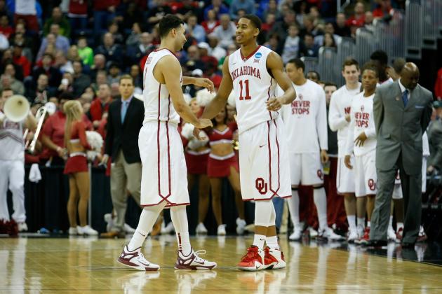 COLUMBUS, OH - MARCH 20: Frank Booker #1 (L) and Isaiah Cousins #11 of the Oklahoma Sooners celebrate following the Sooners 69-60 win over the Albany Great Danes during the second round of the 2015 NCAA Men's Basketball Tournament at Nationwide Arena on March 20, 2015 in Columbus, Ohio. (Photo by Kirk Irwin/Getty Images)