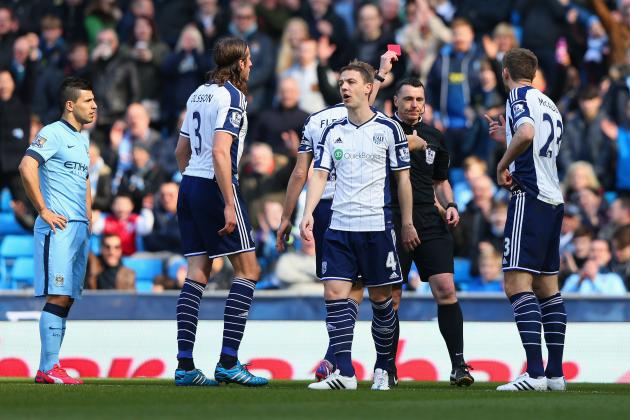 MANCHESTER, ENGLAND - MARCH 21:  Referee Neil Swarbrick shows Gareth McAuley of West Brom (R) a red card during the Barclays Premier League match between Manchester City and West Bromwich Albion at Etihad Stadium on March 21, 2015 in Manchester, England.  (Photo by Alex Livesey/Getty Images)