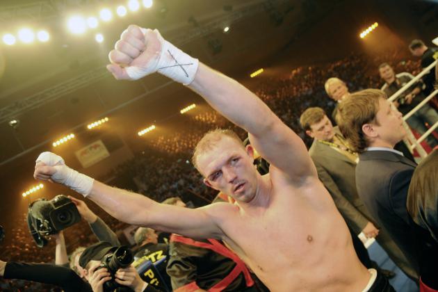 German Juergen Braehmer jubilates after winning the  WBO World Championship Light Heavyweight title fight Russian Boxer Dmitry Sukhotsky in Schwerin, northern Germany, at Saturday, Dec. 19, 2009. Braehmer won the fight by point decision after 12 rounds. (AP Photo/Frank Hormann)