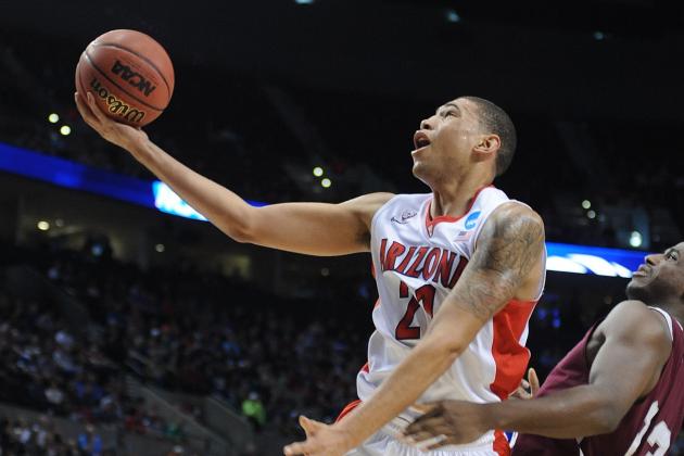 Arizona forward Brandon Ashley, left, goes to the basket against Texas Southern forward Nick Shepherd during the first half of an NCAA college basketball second round game in Portland, Ore., Thursday, March 19, 2015. (AP Photo/Greg Wahl-Stephens)
