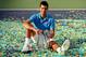 Novak Djokovic poses with the trophy after winning the 2015 BNP Paribas Open.
