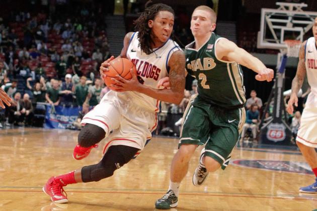 Mar 13, 2015; Birmingham, AL, USA; Louisiana Tech Bulldogs guard Kenneth Smith (4) drives to the basket against UAB Blazers guard Nick Norton (2) during the semifinals of the Conference USA tournament at Jefferson Convention Complex. The Blazers defeated the Bulldogs 72-62. Mandatory Credit: Marvin Gentry-USA TODAY Sports