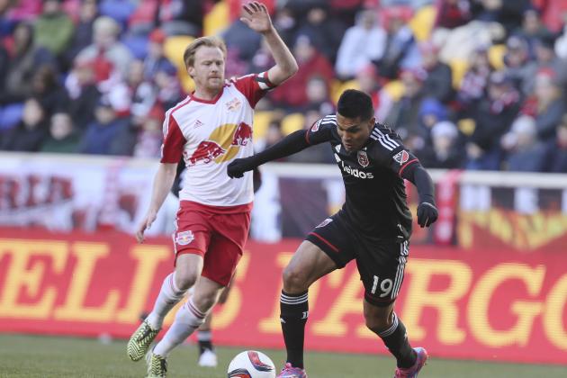 D.C. United forward Jairo Arrieta (19) dribbles past New York Red Bulls midfielder Dax McCarty during the first half of an MLS soccer game, Sunday, March 22, 2015, in Harrison, N.J. The Red Bulls won 2-0. (AP Photo/John Minchillo)