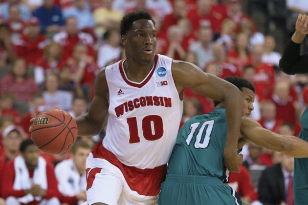 Wisconsin's Nigel Hayes, left, drives past Coastal Carolina's Shivaughn Wiggins (10) during the second half of an NCAA tournament college basketball game in the Round of 64 in Omaha, Neb., Friday, March 20, 2015. (AP Photo/Nati Harnik)