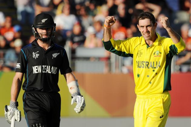 Australia's Glenn Maxwell celebrates after taking the wicket of New Zealand’s Corey Anderson as New Zealand’s Kane Williamson, left, watches during their Cricket World Cup match in Auckland, New Zealand, Saturday, Feb. 28, 2015. (AP Photo Ross Setford)