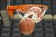 Basketballs head through the hoops in the practice session for Lafayette for an NCAA college basketball second round game in Pittsburgh Wednesday, March 18, 2015. (AP Photo/Keith Srakocic)
