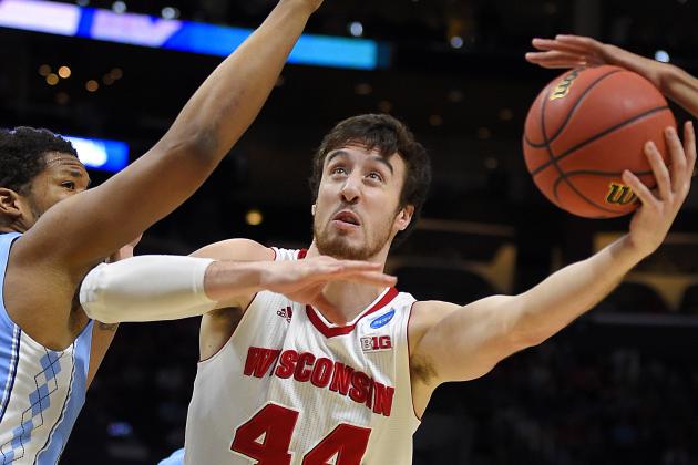 North Carolina forward Kennedy Meeks, left, defends Wisconsin forward Frank Kaminsky during the first half of a college basketball regional semifinal in the NCAA Tournament, Thursday, March 26, 2015, in Los Angeles. (AP Photo/Mark J. Terrill)