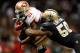 NEW ORLEANS, LA - NOVEMBER 25: Frank Gore #21 of the San Francisco 49ers is tackled by Curtis Lofton #50 of the New Orleans Saints at The Mercedes-Benz Superdome on November 25, 2012 in New Orleans, Louisiana. The 49ers defeated the Saints 31-21. (Photo by Chris Graythen/Getty Images)