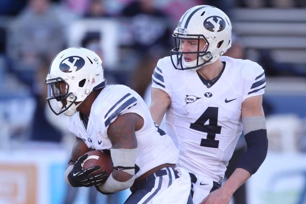 BYU quarterback Taysom Hill (4) hands off to Jamaal Williams (21) during the second half of an NCAA college football game against Nevada, in Reno, Nev., on Saturday, Nov. 30, 2013. BYU defeated Nevada 28-23. (AP Photo/Cathleen Allison)