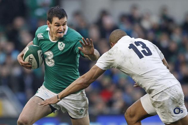 Ireland's Jonny Sexton, left, hands off England's Jonathan Joseph during their rugby union 6 nations match at the Aviva stadium, Dublin, Ireland, Sunday, March, 1, 2015.  (AP Photo/Peter Morrison)