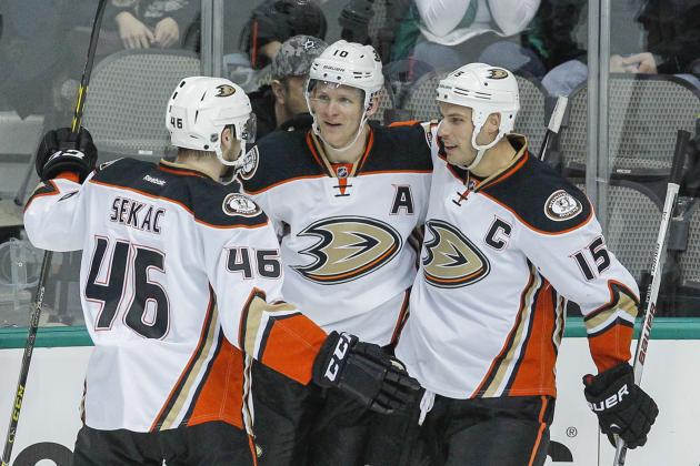 Anaheim Ducks players Jiri Sekac (46), Ryan Getzlaf (15) and Cam Fowler (4) congratulalte right wing Corey Perry, 2nd from left, for his goal against Dallas Stars goalie Jhonas Enroth in the first period of an NHL hockey game Sunday, March 1, 2015, in Dallas.  (AP Photo/Tim Sharp)