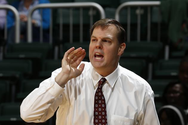 Eastern Kentucky coach Jeff Neubauer talks to his players during the first half against Miami in an NCAA college basketball game in Coral Gables, Fla., Friday, Dec. 19, 2014. (AP Photo/Joel Auerbach)