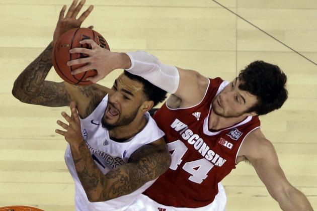 Wisconsin's Frank Kaminsky (44) blocks a shot by Kentucky's Willie Cauley-Stein during the second half of the NCAA Final Four tournament college basketball semifinal game Saturday, April 4, 2015, in Indianapolis. (AP Photo/David J. Phillip)