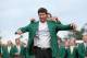 AUGUSTA, GA - APRIL 13: Adam Scott of Australia presents Bubba Watson of the United States with the green jacket after Watson won the 2014 Masters Tournament by a three-stroke margin at Augusta National Golf Club on April 13, 2014 in Augusta, Georgia. (Photo by Ezra Shaw/Getty Images for Golfweek)
