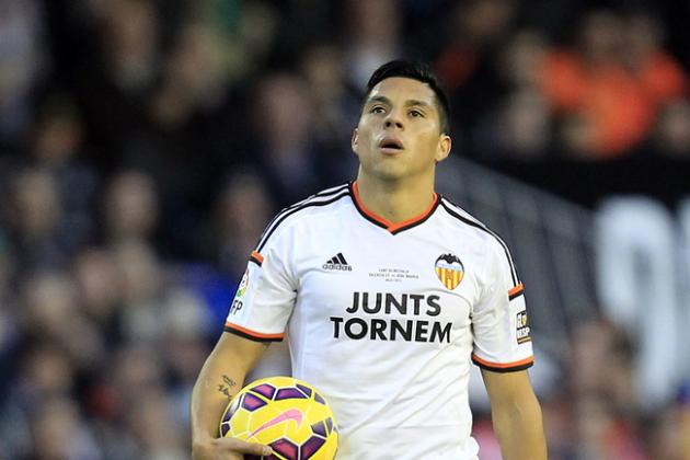 Valencia's new player Enzo Perez, from Argentina, walks on the pitch during a Spanish La Liga soccer match against Real Madrid at the Mestalla stadium in Valencia, Spain, on Sunday, Jan. 4, 2015.(AP Photo/Alberto Saiz)