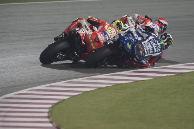 DOHA, QATAR - MARCH 29: Andrea Dovizioso of Italy and Ducati Team, Valentino Rossi of Italy and Movistar Yamaha MotoGP
 and Andrea Iannone of Italy and Ducati Team round the bend during the MotoGP race during the MotoGp of Qatar - Race  at Losail Circuit on March 29, 2015 in Doha, Qatar.  (Photo by Mirco Lazzari gp/Getty Images)