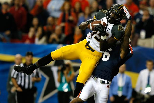 ATLANTA, GA - DECEMBER 07:  Dorial Green-Beckham #15 of the Missouri Tigers scores a touchdown in the first quarter against the Jonathon Mincy #6 of the Auburn Tigers during the SEC Championship Game at Georgia Dome on December 7, 2013 in Atlanta, Georgia.  (Photo by Kevin C. Cox/Getty Images)