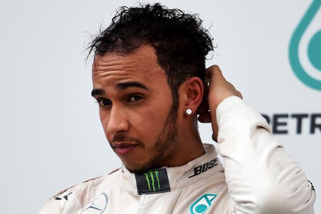 KUALA LUMPUR, MALAYSIA - MARCH 29:  Lewis Hamilton of Great Britain and Mercedes GP looks on as he stands on the podium aftrer finishing second in the Malaysia Formula One Grand Prix at Sepang Circuit on March 29, 2015 in Kuala Lumpur, Malaysia.  (Photo by Lars Baron/Getty Images)