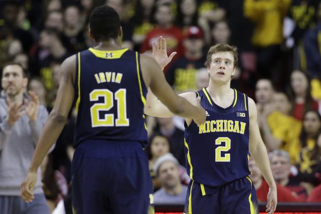 Michigan guard Spike Albrecht, right, high-fives teammate Zak Irvin in the second half of an NCAA college basketball game against Maryland, Saturday, Feb. 28, 2015, in College Park, Md. (AP Photo/Patrick Semansky)