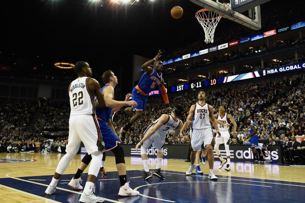 LONDON, ENGLAND - JANUARY 15:  Tim Hardaway Jr of the New York Knicks runs into Ersan Ilyasova of Milwaukee Bucks during the NBA match between New York Knicks and Milwaukee Bucks at O2 Arena on January 15, 2015 in London, England. NOTE TO USER: User expressly acknowledges and agrees that, by downloading and or using this photograph, User is consenting to the terms and conditions of the Getty Images License Agreement. (Photo by Mike Hewitt/Getty Images)