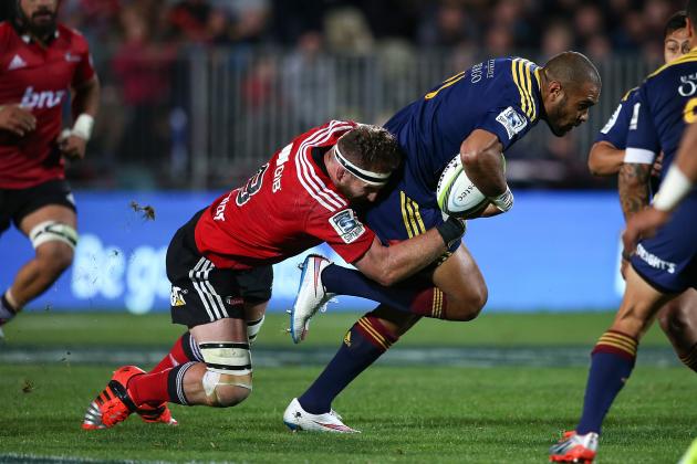 CHRISTCHURCH, NEW ZEALAND - APRIL 11: Patrick Osborne of the Highlanders
is tackled by Kieran Read of the Crusaders during the round nine Super Rugby match between the Crusaders and the Highlanders at AMI Stadium on April 11, 2015 in Christchurch, New Zealand. (Photo by Martin Hunter/Getty Images)