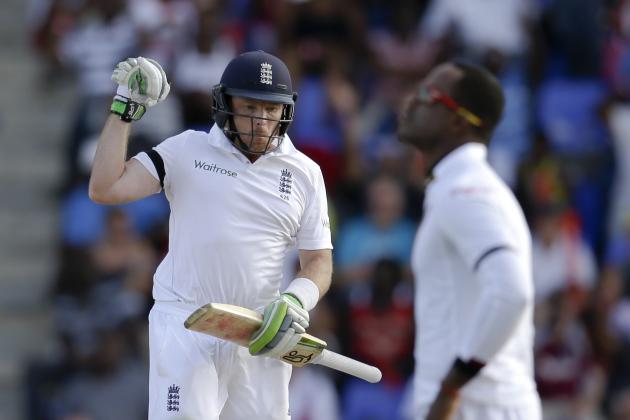 England's Ian Bell celebrates scoring a century after hitting a four off West Indies' Marlon Samuels, right, during the opening day of their first cricket Test match at the Sir Vivian Richards Cricket Ground in Antigua, Antigua and Barbuda, Monday, April 13, 2015.  (AP Photo/Ricardo Mazalan)