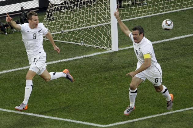 New Zealand's Shane Smeltz, left, celebrates with his teammate Ryan Nelsen after scoring during the World Cup group F soccer match between Italy and New Zealand at Mbombela Stadium in Nelspruit, South Africa, Sunday, June 20, 2010. (AP Photo/Michael Sohn)