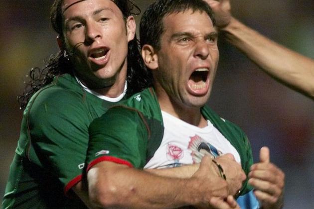 Mexico's Antonio De Nigris embraces Alberto Garcia Aspe after he scored the second goal against Uruguay during a Copa America semifinal game in Pereira, Colombia, Wednesday, July 25, 2001. (AP Photo/Daniel Jayo)