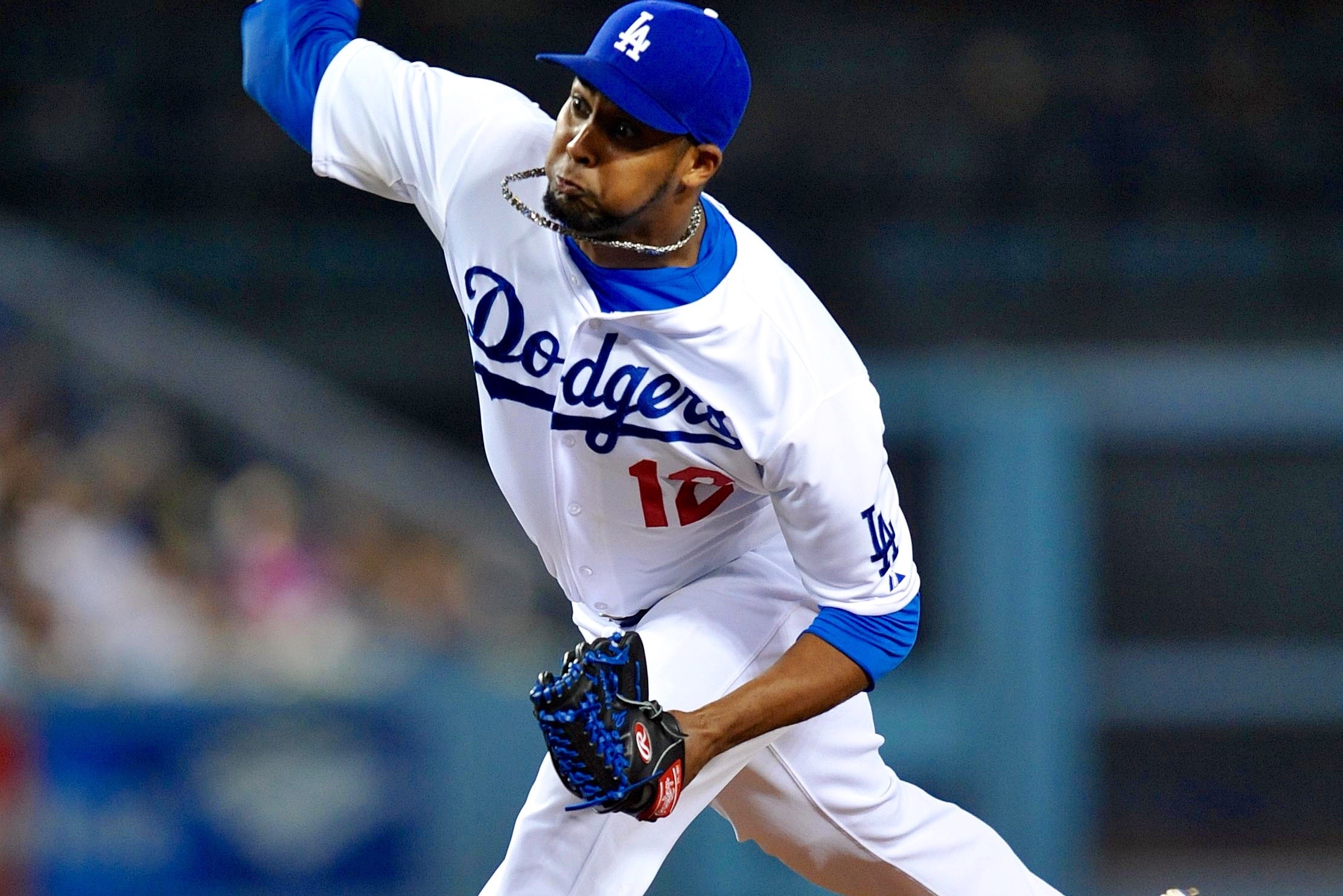 Los Angeles Dodgers relief pitcher Yimi Garcia, front, pounds his