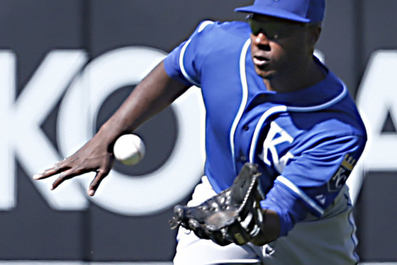 Kansas City Royals center fielder Lorenzo Cain makes a running catch off Los Angeles Angels' Drew Buterain the ninth inning of  a baseball game in Anaheim, Calif. on Sunday, April 12, 2015. Kansas City won 9-2. (AP Photo/Christine Cotter)