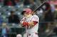 Apr 14, 2015; Arlington, TX, USA; Los Angeles Angels center fielder Mike Trout (27) follows through on a double against the Texas Rangers during the first inning of a baseball game at Globe Life Park in Arlington. Mandatory Credit: Jim Cowsert-USA TODAY Sports
