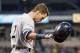 Apr 17, 2015; Pittsburgh, PA, USA; Milwaukee Brewers second baseman Scooter Gennett (2) tosses his helmet after striking out to end the fourth inning against the Pittsburgh Pirates at PNC Park. Mandatory Credit: Charles LeClaire-USA TODAY Sports