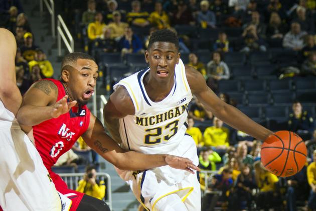 N.J.I.T. guard Ky Howard (0) defends as Michigan guard Caris LeVert (23) dribbles the ball during the first half of an NCAA college basketball game at Crisler Center in Ann Arbor, Mich., Saturday, Dec. 6, 2014. (AP Photo/Tony Ding)